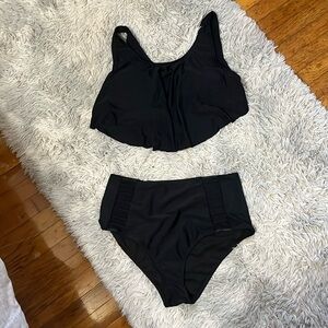 Black plus swimsuit flowing to with full coverage bottoms